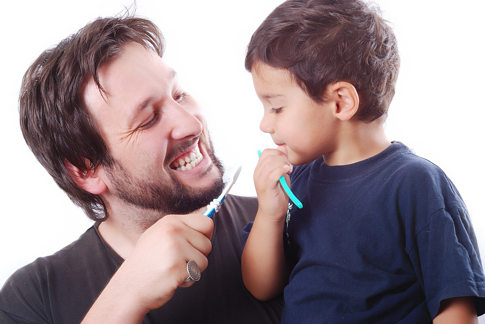 child brushing teeth