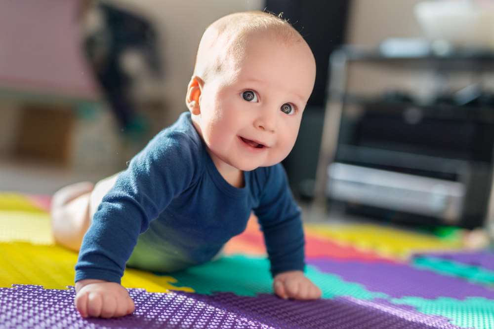 baby on play mat