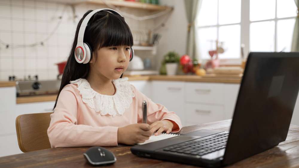 child studying at home