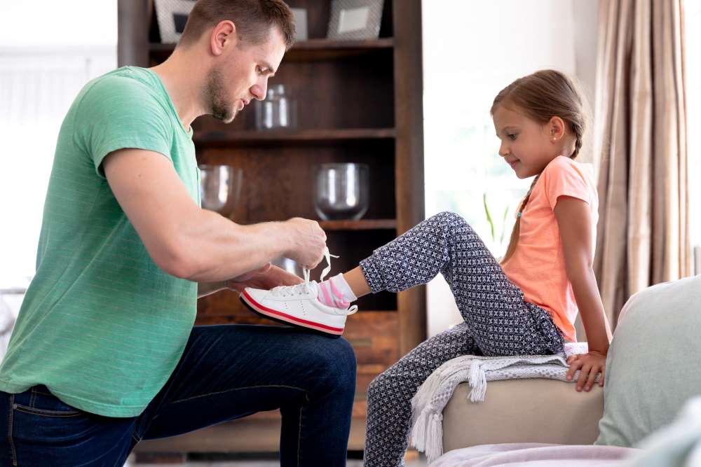 child putting on shoes