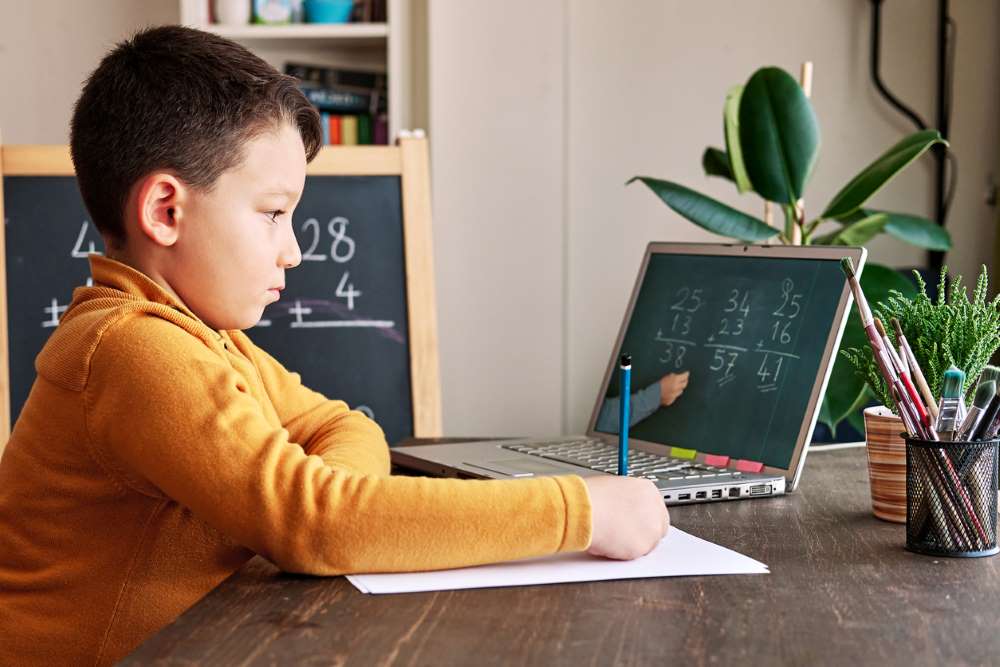 elementary school kid solving math