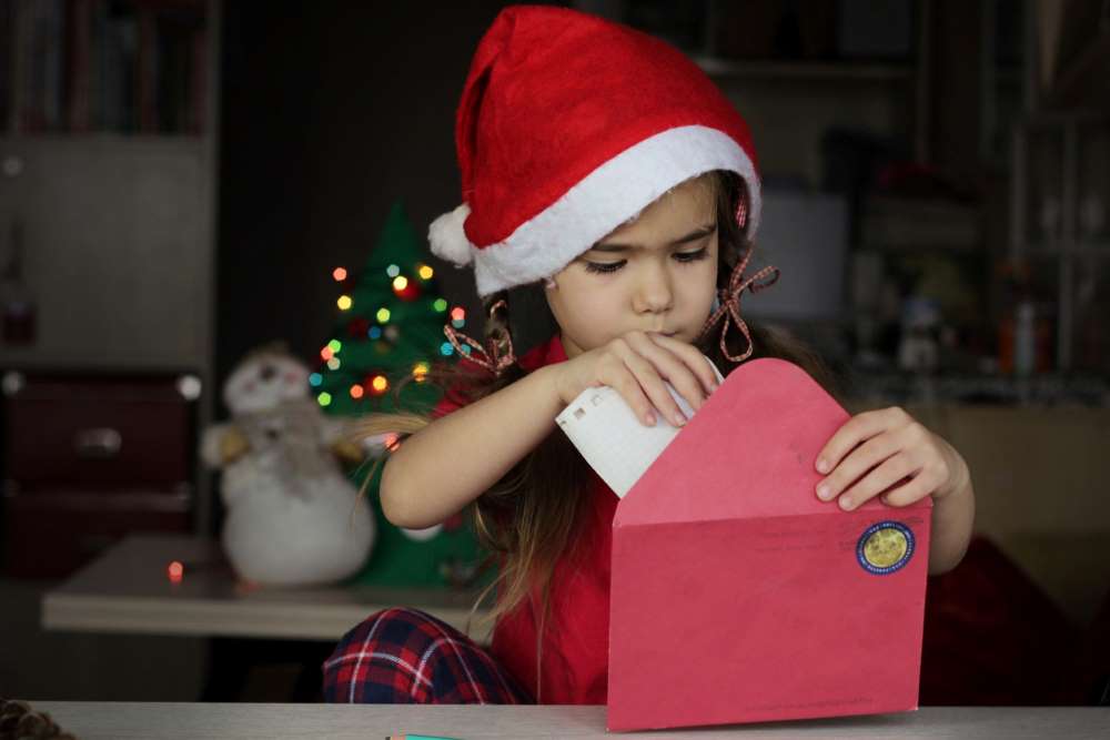 girl writing letter for Santa