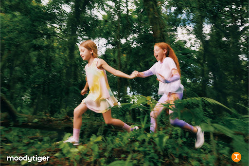 girls running in sports attire