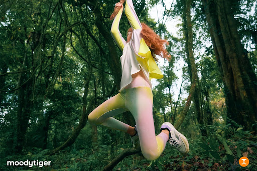 girl jumping in sports attire