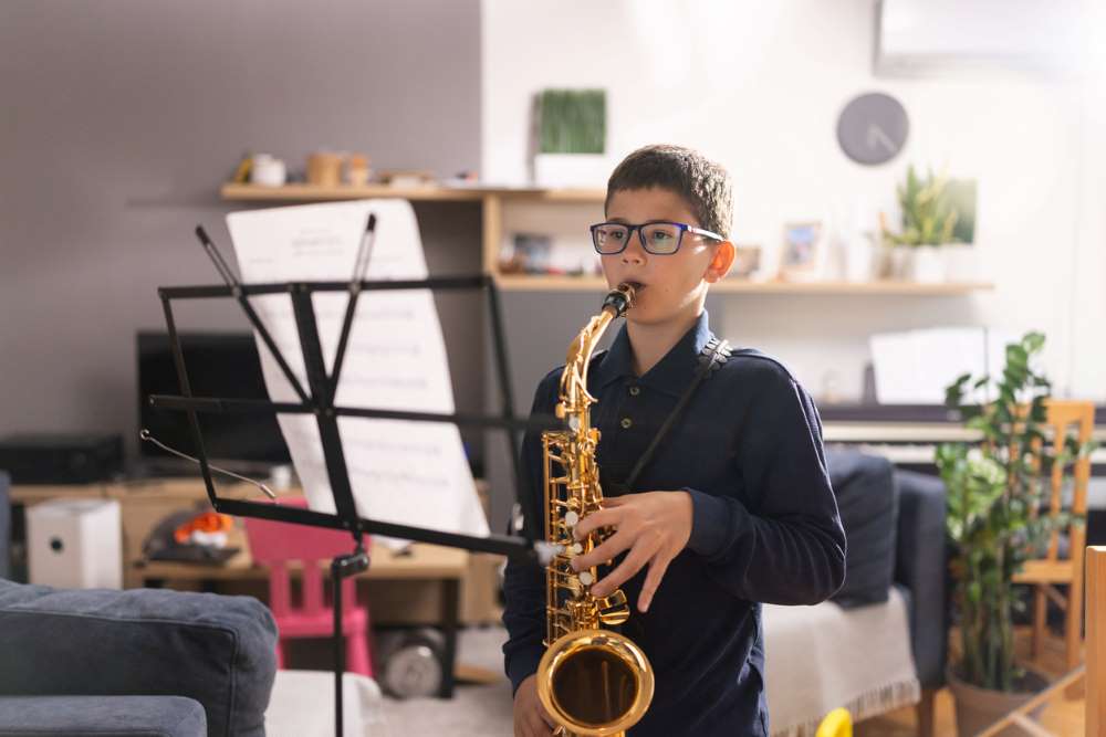 kid playing sax