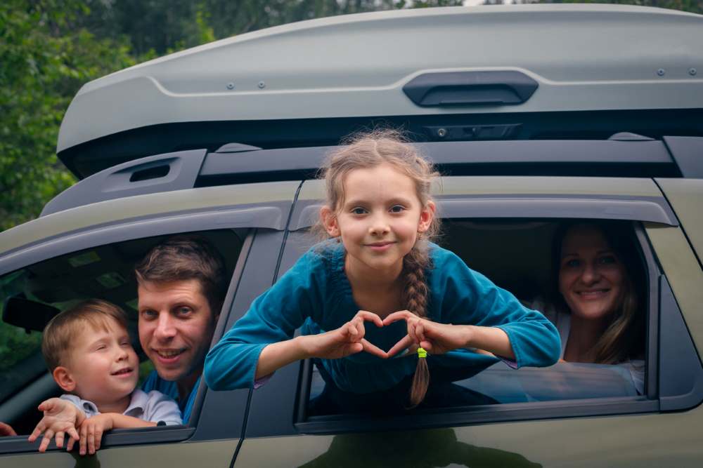 kids in car on a roadtrip