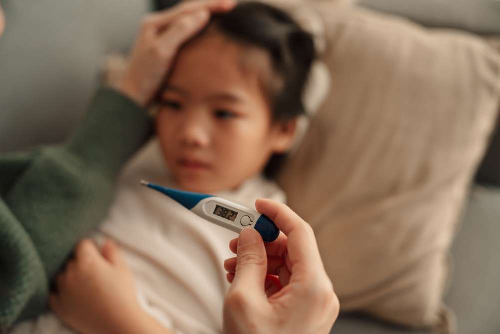 sick kid with fever