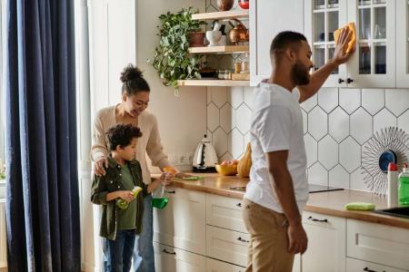 family cleaning kitchen together