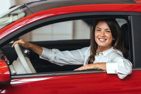 lady smiling from car window