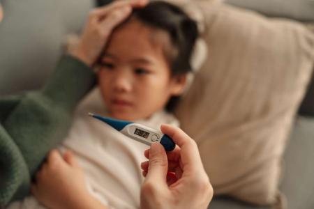 sick kid with fever