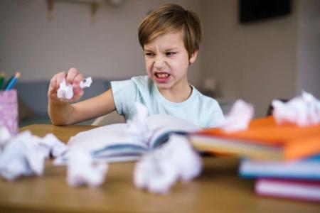 stressed kid doing homework