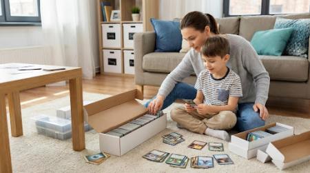 kid playing with trading cards
