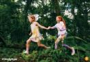 girls running in sports attire