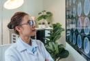 Neurologist looking at brain scans