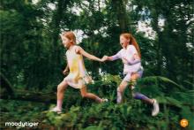 girls running in sports attire