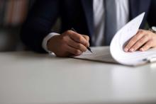 injury attorney signing paperwork