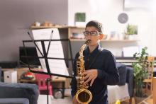 kid playing sax