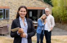 realtor with home buyers