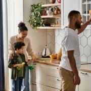 family cleaning kitchen together