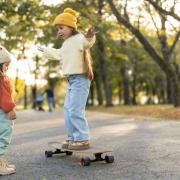 kid learning to skateboard