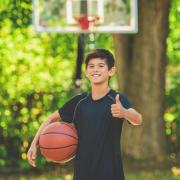 kid playing basketball outside