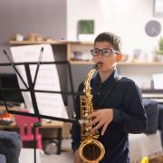 kid playing sax