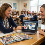 teachers looking at a yearbook