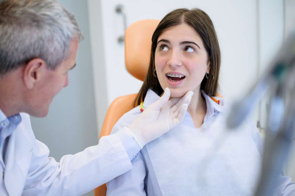 teen with new braces