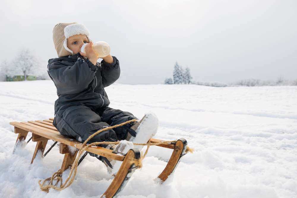 toddle drinking milk from baby bottle