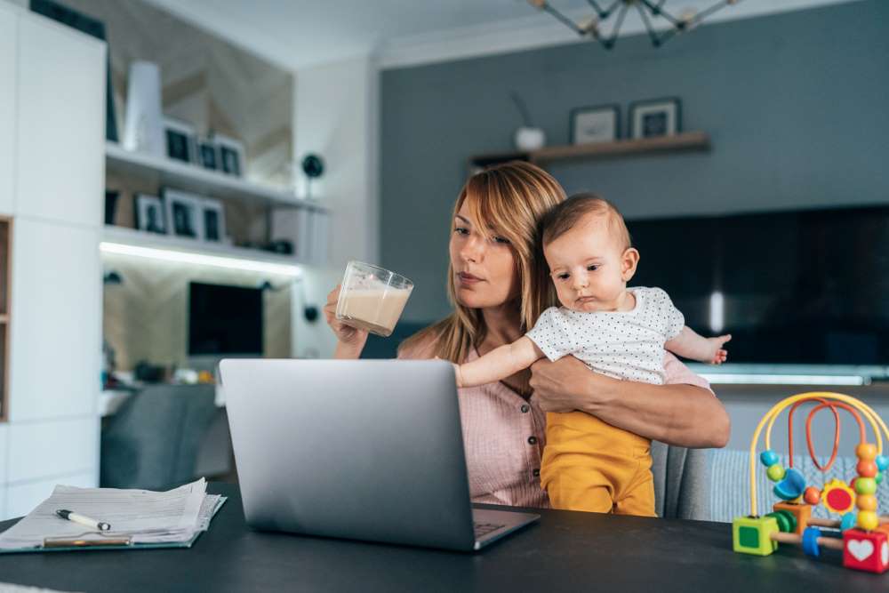 mom with baby working from home